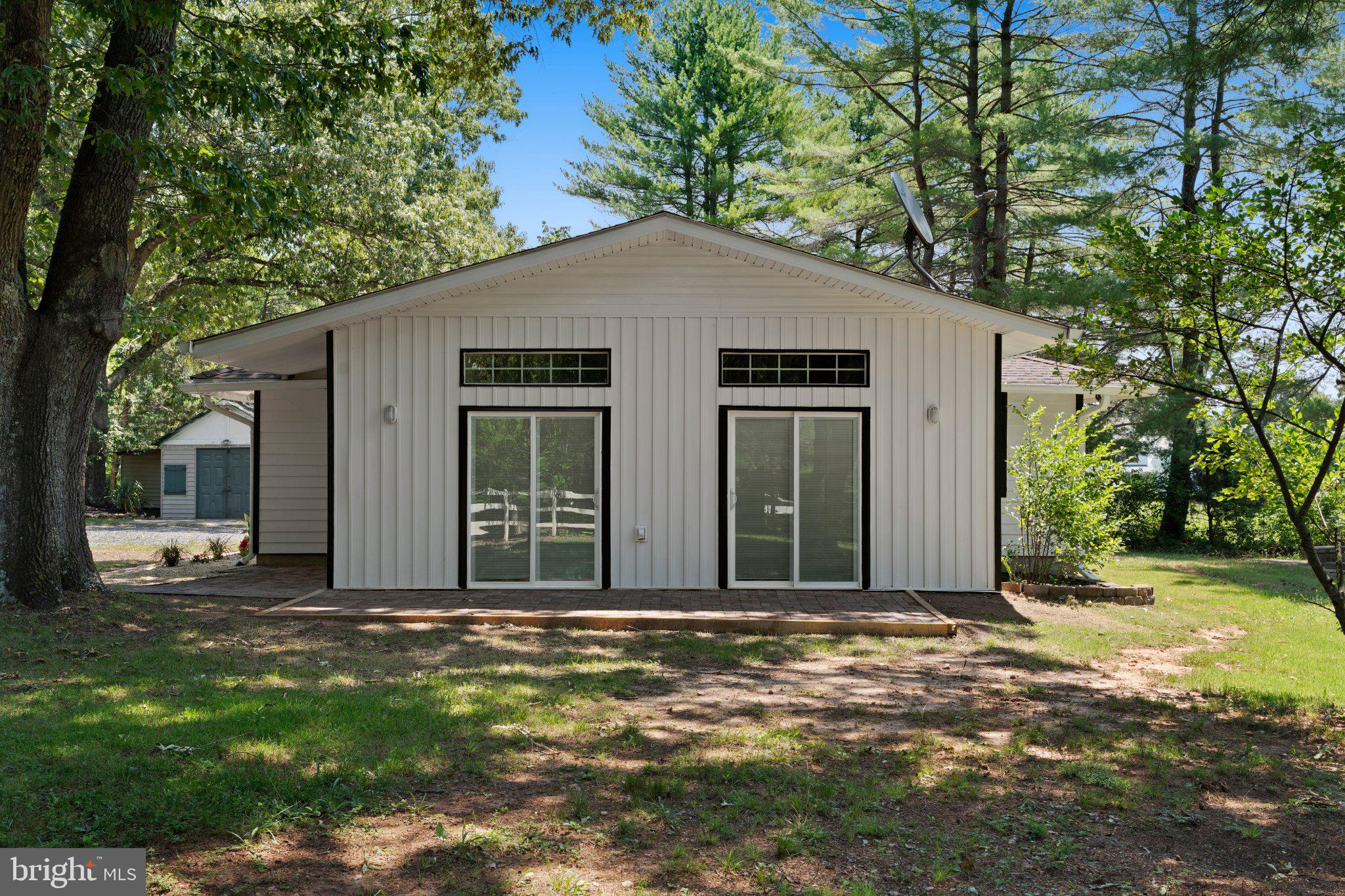 8405 Shirley Road Spotsylvania, VA 22551 - Photo 2 of 42 a front view of a house with a yard
