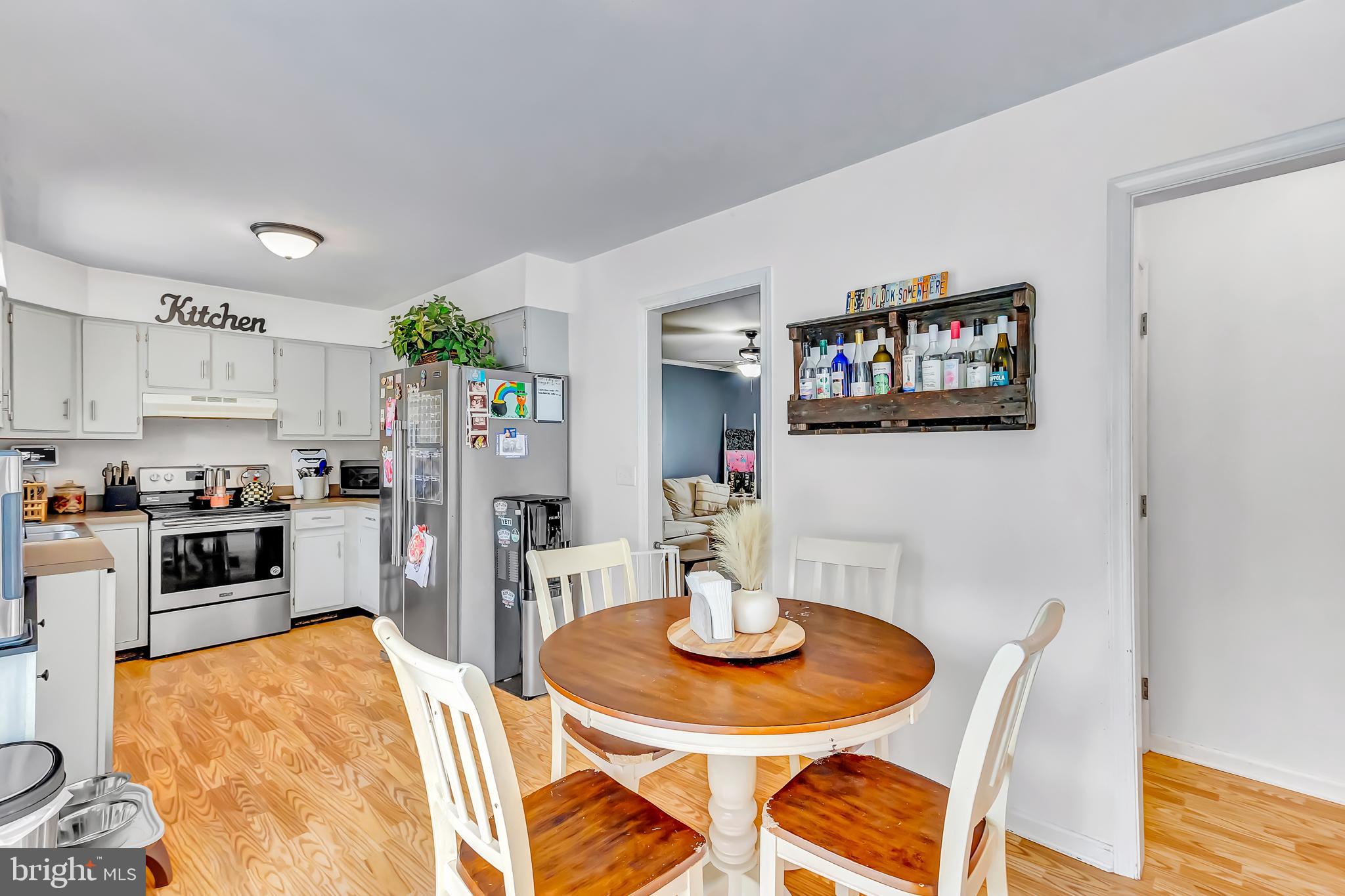4925 Campground Road Eden, MD 21822 - Photo 6 of 42 a kitchen with stainless steel appliances kitchen island granite countertop a dining table and chairs