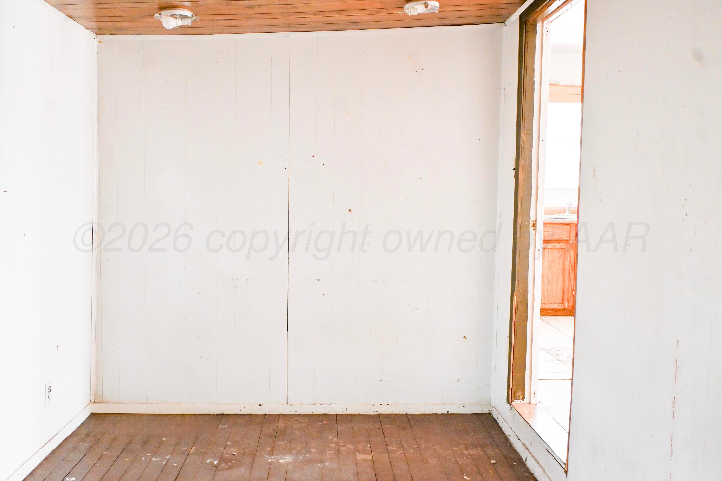 1210 Southwest 12th Avenue Amarillo, TX 79102 - Photo 5 of 12 a view of a small space with wooden floor and a window
