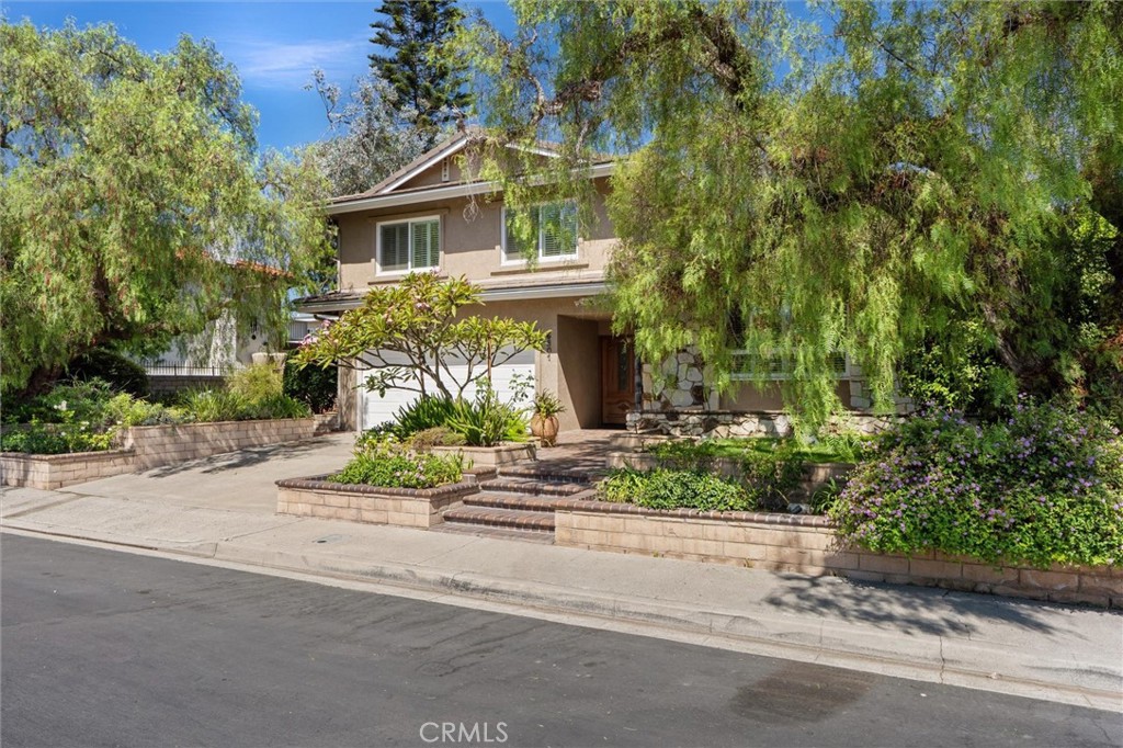 6301 East Bixby Hill Road Long Beach, CA 90815 - Photo 2 of 48 front view of house with a street