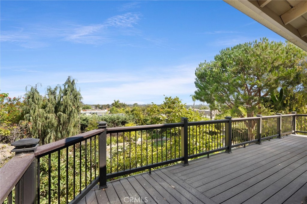 6301 East Bixby Hill Road Long Beach, CA 90815 - Photo 24 of 48 a view of a balcony with wooden floor