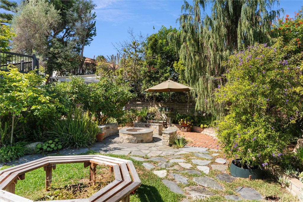 6301 East Bixby Hill Road Long Beach, CA 90815 - Photo 28 of 48 a view of backyard with swimming pool and outdoor seating