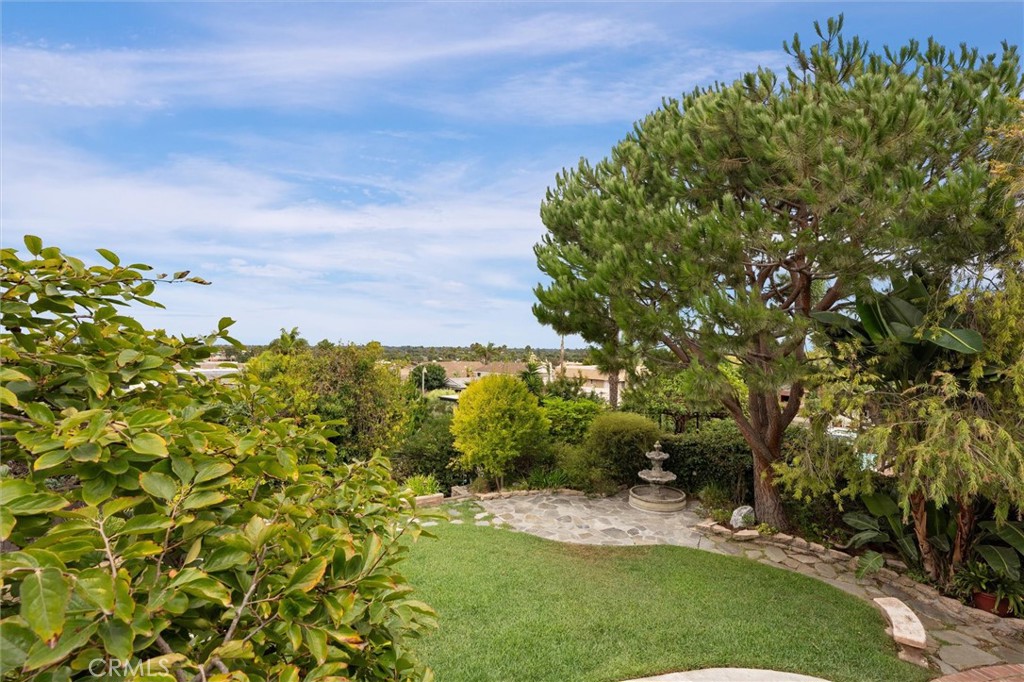 6301 East Bixby Hill Road Long Beach, CA 90815 - Photo 30 of 48 a view of a big yard with plants and large trees