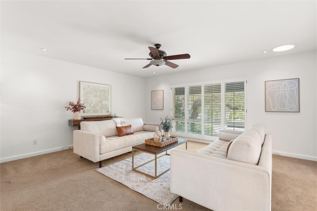 6301 East Bixby Hill Road Long Beach, CA 90815 - Photo 7 of 48 a living room with furniture and a large window