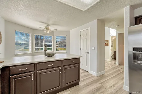 a kitchen with stainless steel appliances granite countertop cabinets and window