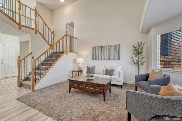 a living room with furniture and a rug
