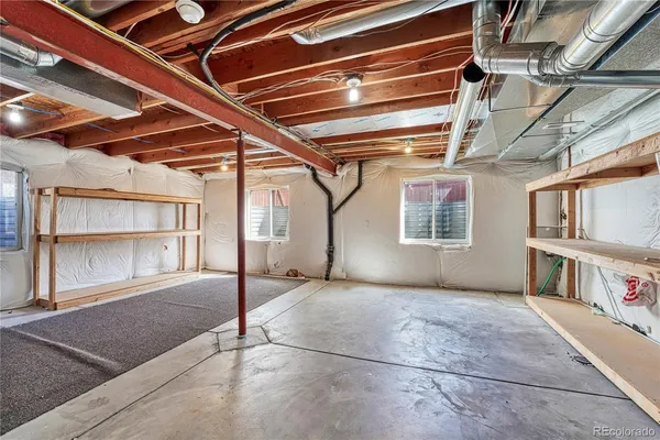a view of an empty room with cabinet