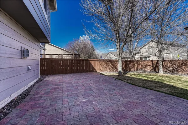 a view of backyard with large trees