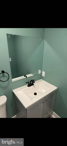 a kitchen with stainless steel appliances a stove and a microwave