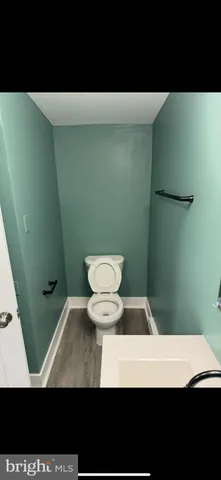 a view of a room with a table and chairs