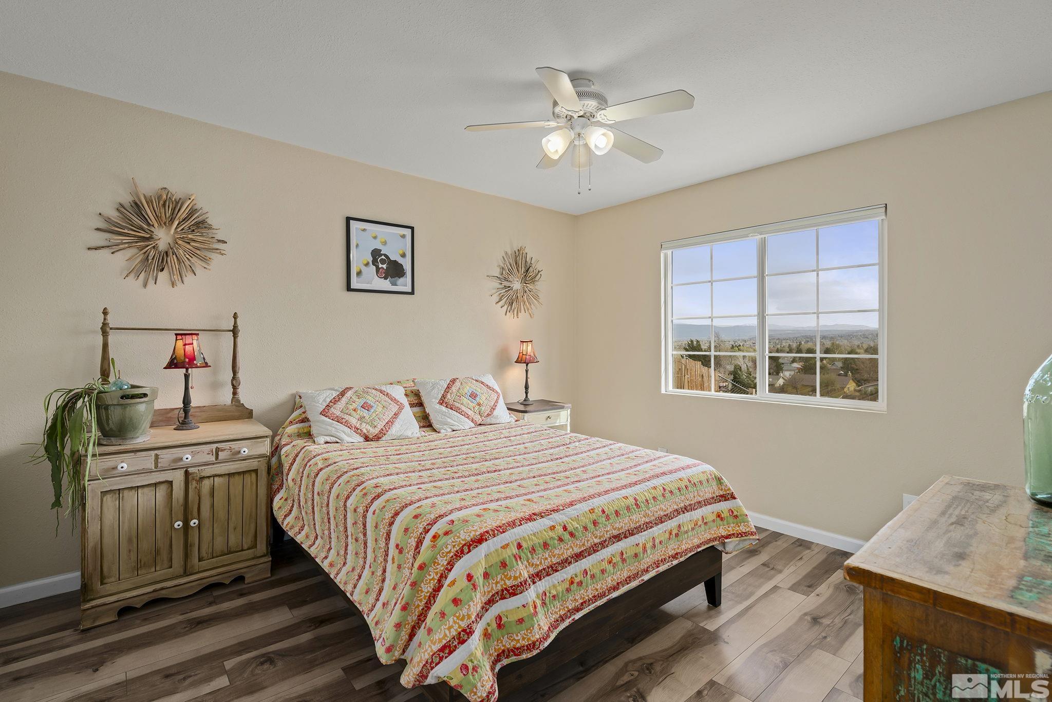 2660 Polk Street Reno, NV 89503 - Photo 13 of 40 a bedroom with a bed and a chandelier