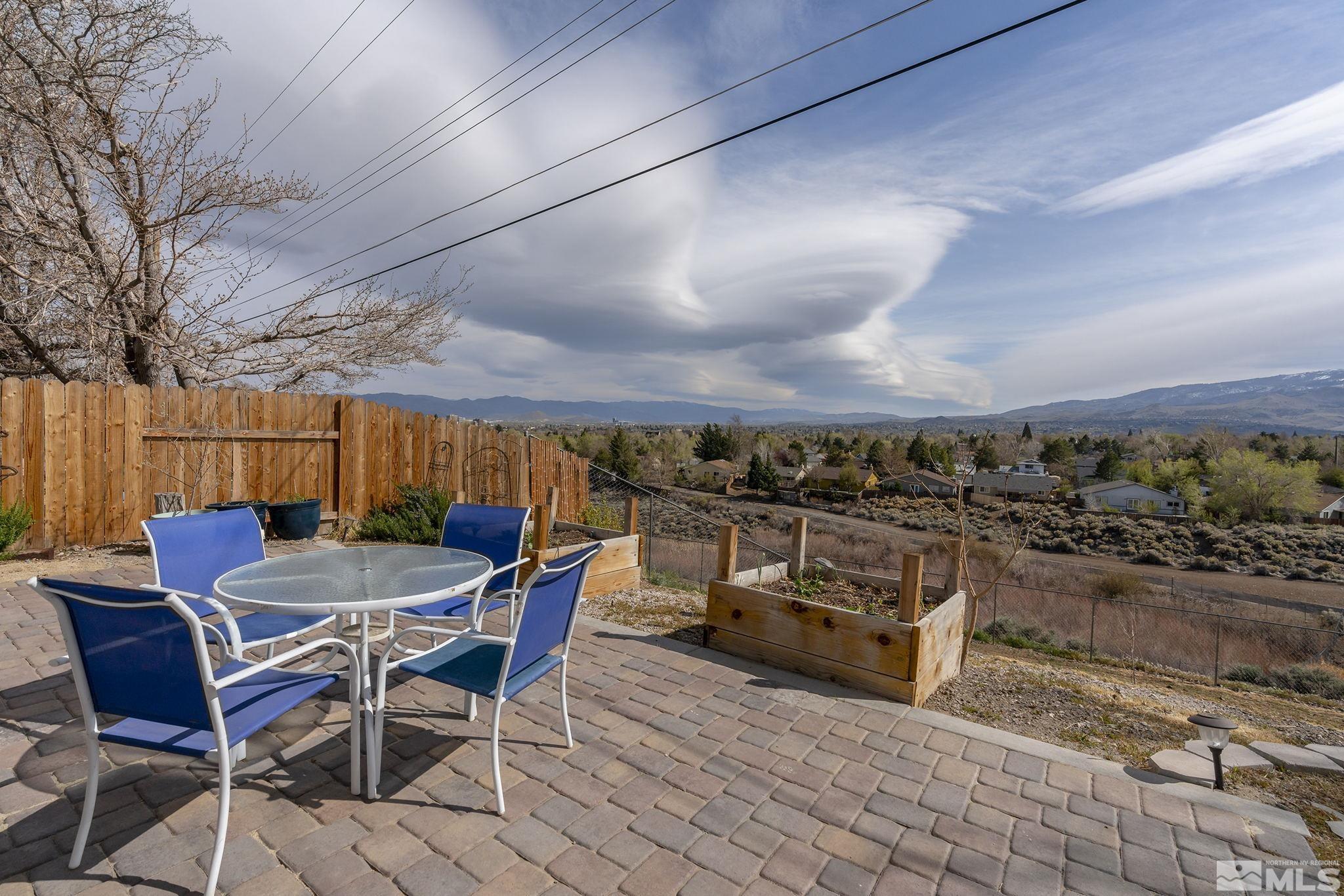 2660 Polk Street Reno, NV 89503 - Photo 33 of 40 a view of a roof deck dining table and chairs