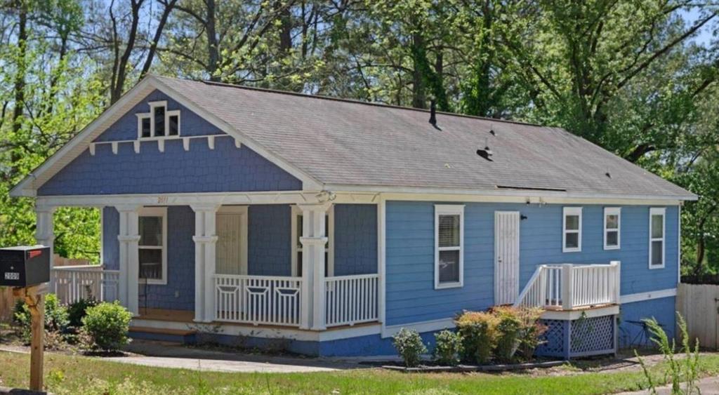 2011 Lewis Road Southeast Atlanta, GA 30315 - Photo 1 of 1 a front view of house with yard and green space