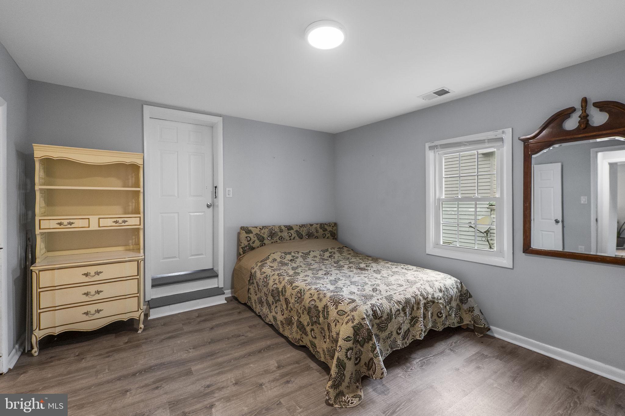 26001 Frederick Road Clarksburg, MD 20871 - Photo 21 of 46 a bedroom with a bed and a closet