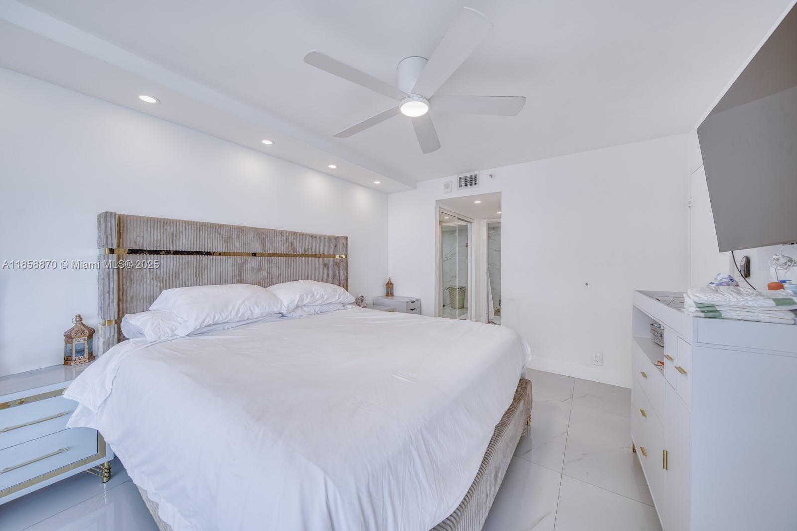 7601 East Treasure Drive, Unit 2424 North Bay Village, FL 33141 - Photo 13 of 25 a bedroom with a bed and a cabinets