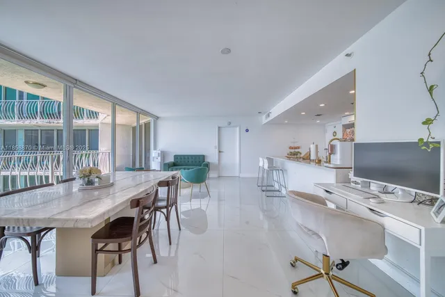 a view of a dining room with furniture and a table