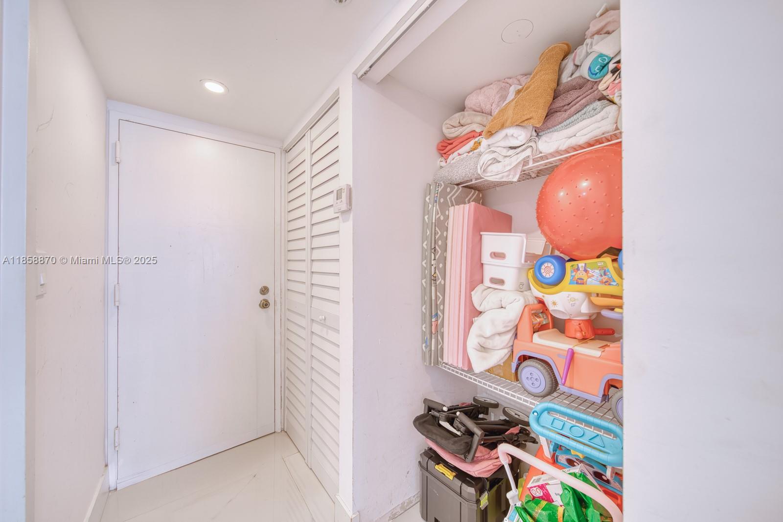 7601 East Treasure Drive, Unit 2424 North Bay Village, FL 33141 - Photo 21 of 25 a bathroom with a sink a vanity and a mirror
