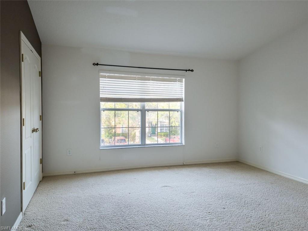 1044 Sleepy Oak Drive Zephyrhills, FL 33543 - Photo 12 of 19 an empty room with a window