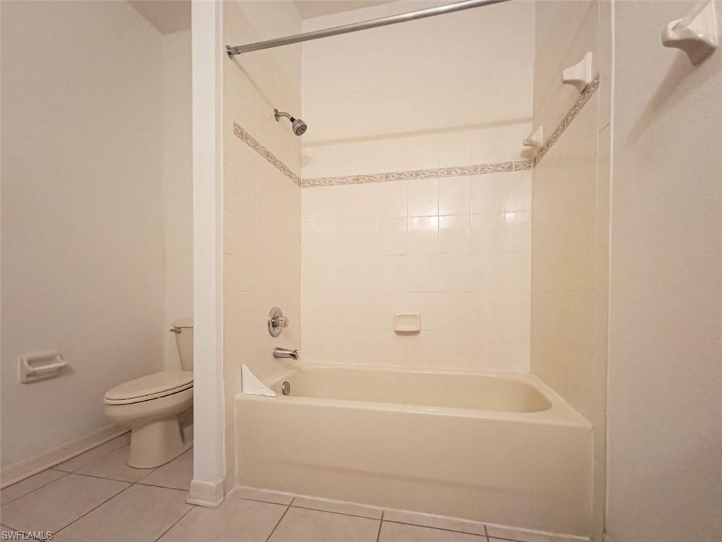 1044 Sleepy Oak Drive Zephyrhills, FL 33543 - Photo 15 of 19 a bathroom with a bathtub a toilet and a shower