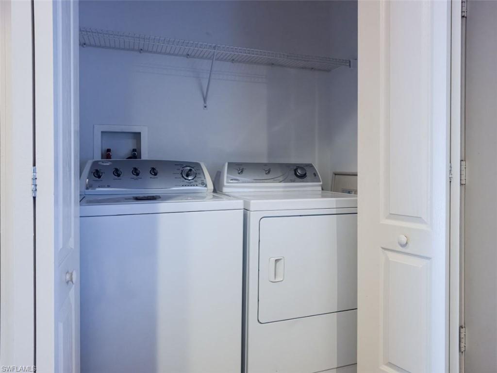 1044 Sleepy Oak Drive Zephyrhills, FL 33543 - Photo 6 of 19 a utility room with dryer and washer