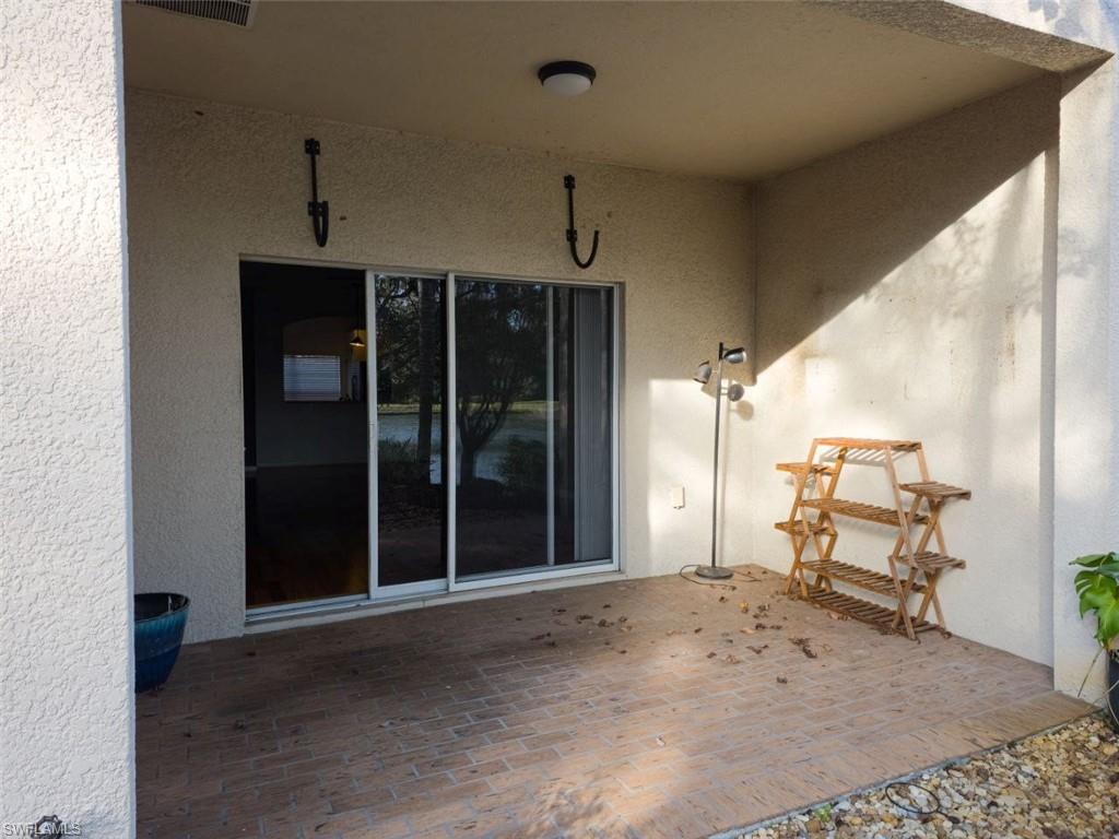 1044 Sleepy Oak Drive Zephyrhills, FL 33543 - Photo 9 of 19 a view of a livingroom with furniture and a ceiling fan