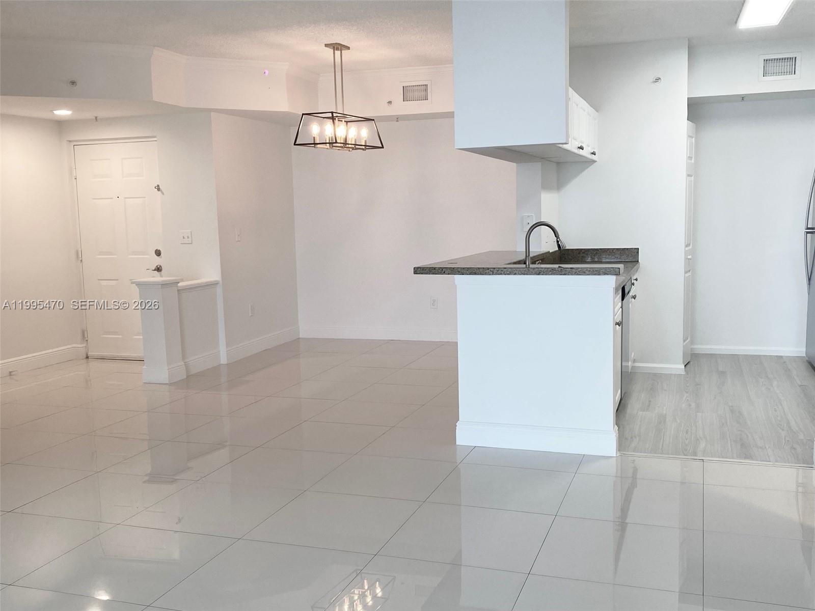 17100 North Bay Road, Unit 1604 Sunny Isles Beach, FL 33160 - Photo 11 of 37 a view of a kitchen with a sink