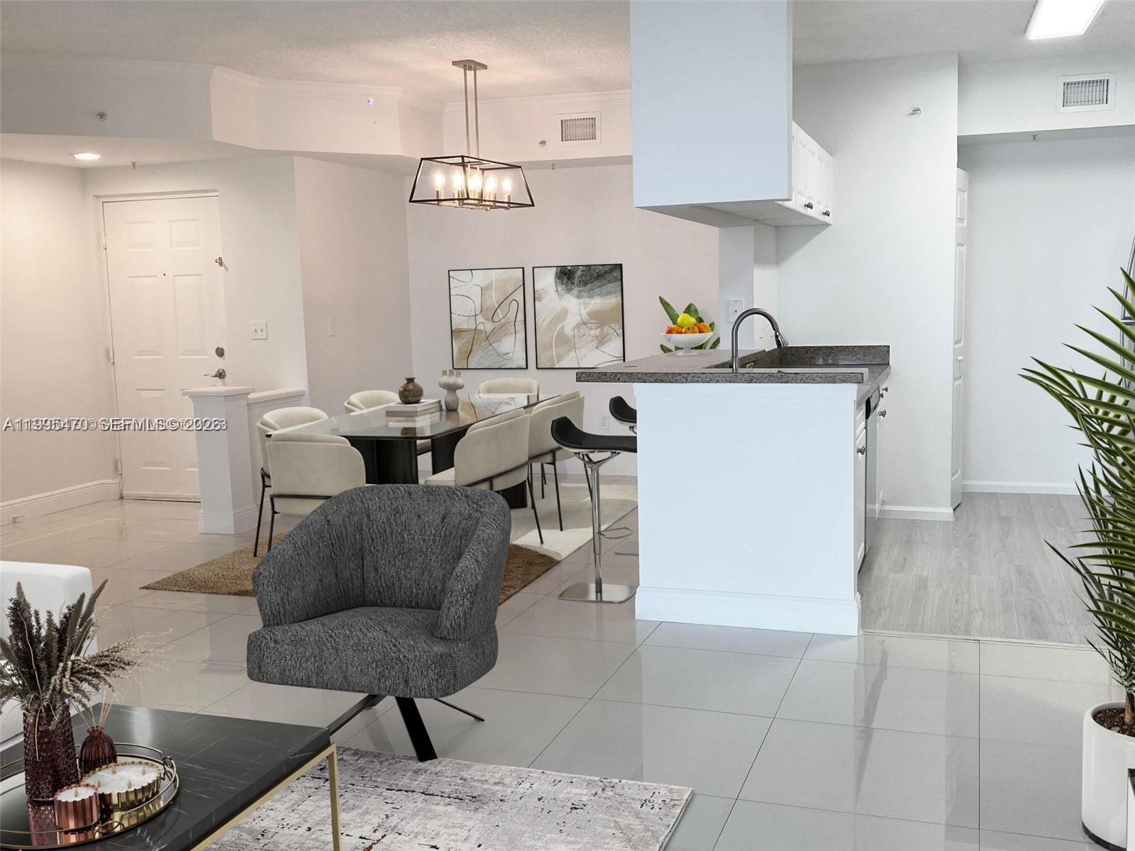 17100 North Bay Road, Unit 1604 Sunny Isles Beach, FL 33160 - Photo 17 of 37 a living room with furniture and a kitchen area