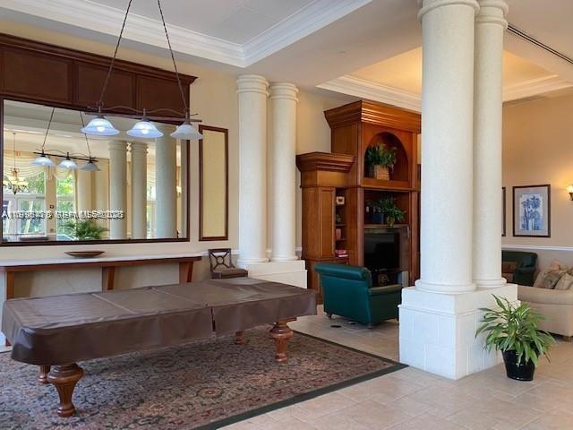 17100 North Bay Road, Unit 1604 Sunny Isles Beach, FL 33160 - Photo 32 of 37 a living room with fireplace furniture and a large window