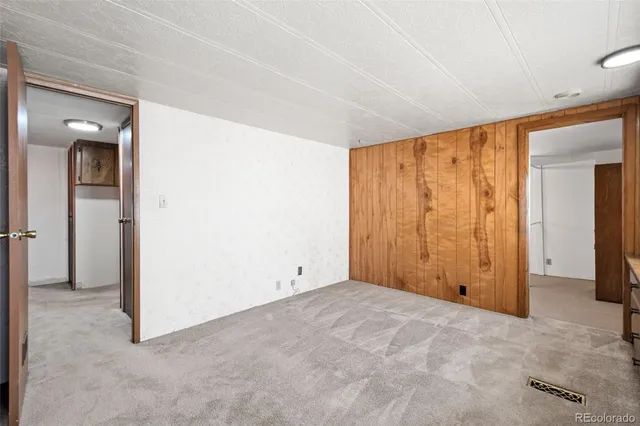 an empty room with closet area