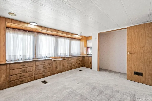 a view of closet area with empty racks