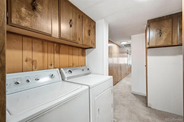 a spacious bathroom with a double vanity sink a large mirror and a bathtub