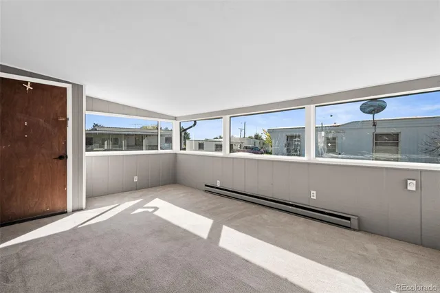 a view of an empty room with a window