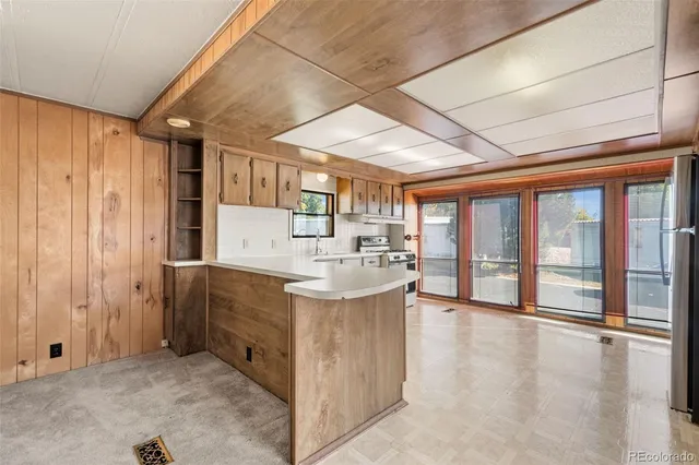 a kitchen with stainless steel appliances granite countertop a sink and cabinets