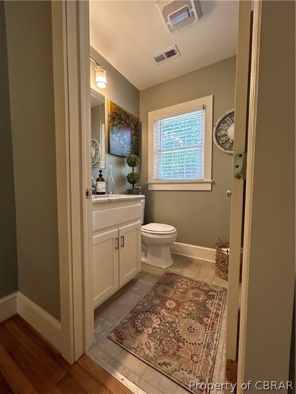 1438 Lafayette Road Gloucester Point, VA 23062 - Photo 21 of 34 Bathroom with vanity, tile floors, and toilet