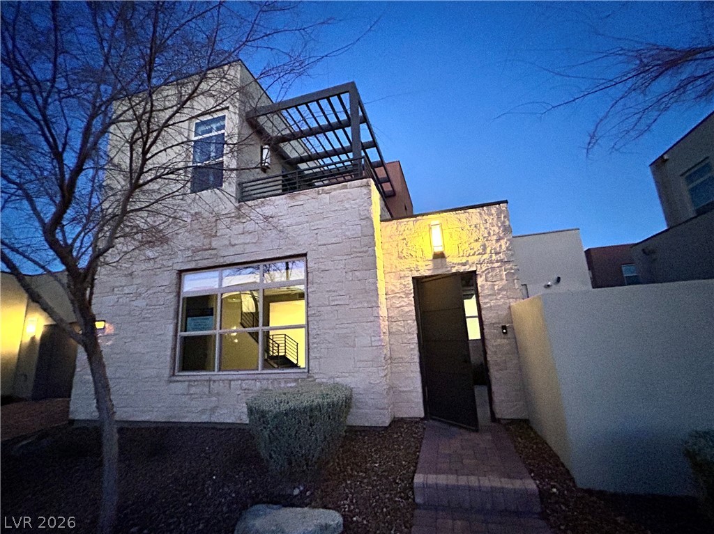 4262 Swift Street Las Vegas, NV 89135 - Photo 3 of 75 View of front facade featuring stone siding