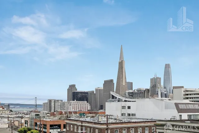 a view of city with a tall building