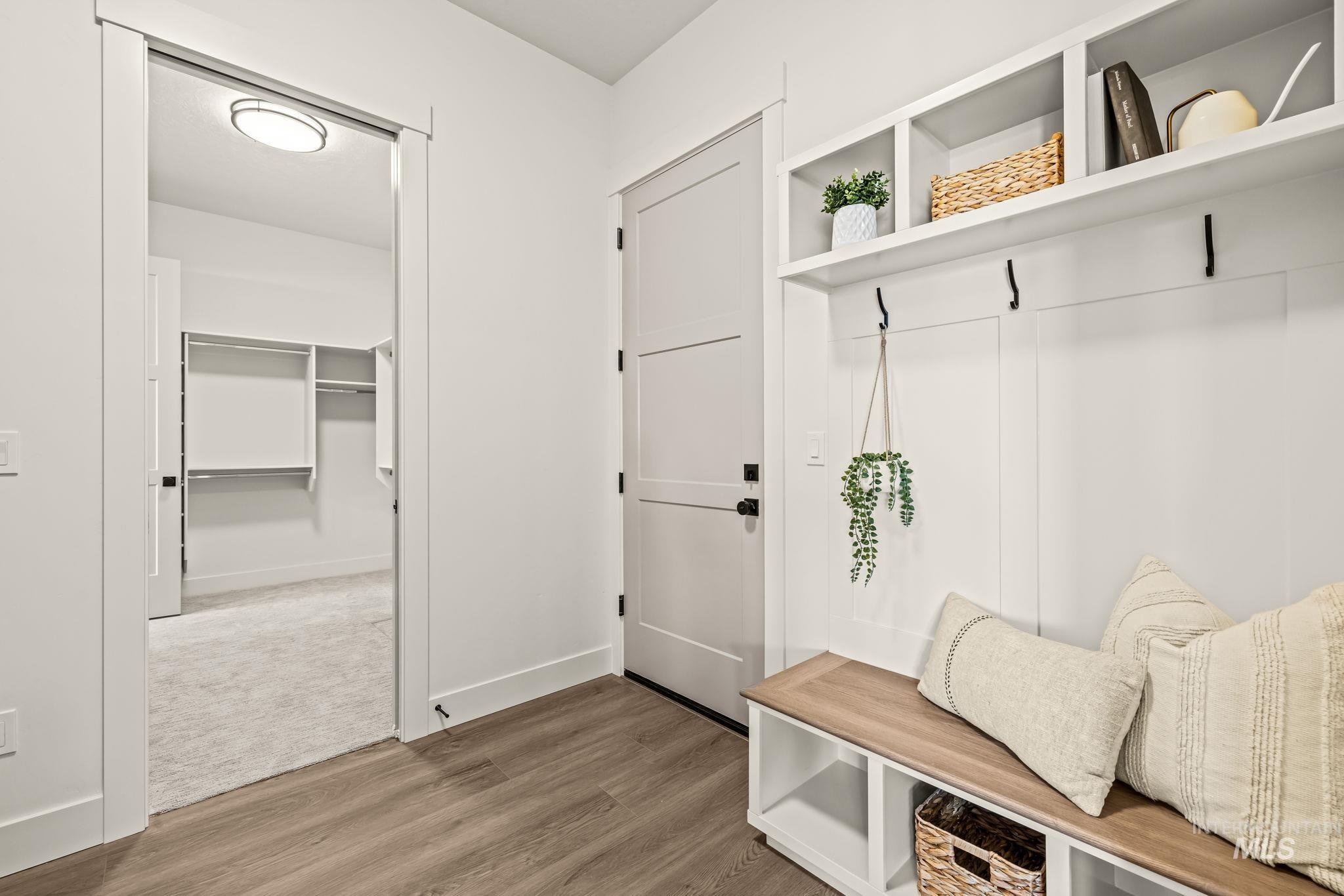345 South Strut Way Boise, ID 83716 - Photo 36 of 50 Built-in entryway bench with storage, overhead shelving, and coat hooks