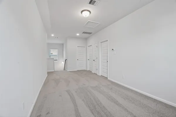 a view of empty room with a fireplace