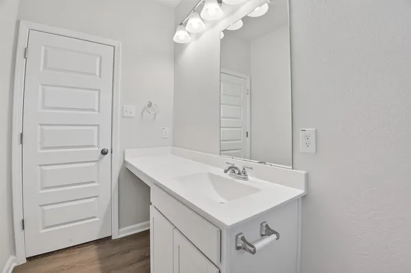 a bathroom with a sink a mirror and a shower