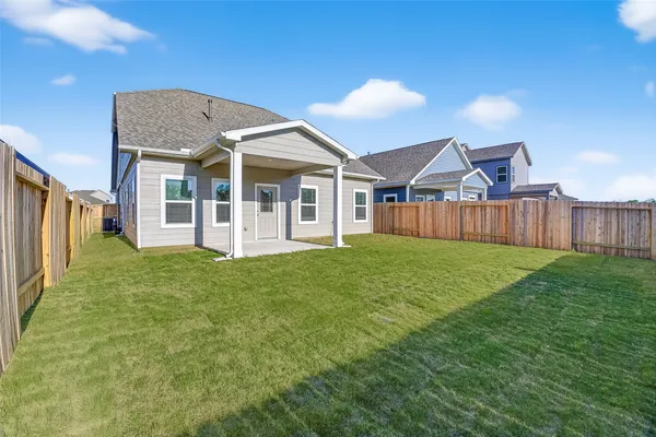 a view of a house with yard and front view of a house