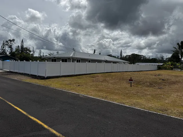 a view of a swimming pool with an outdoor seating