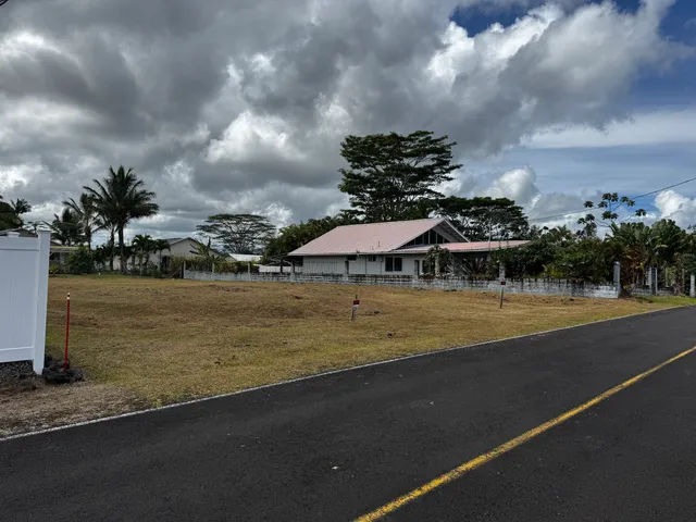 a view of a swimming pool and an outdoor seating