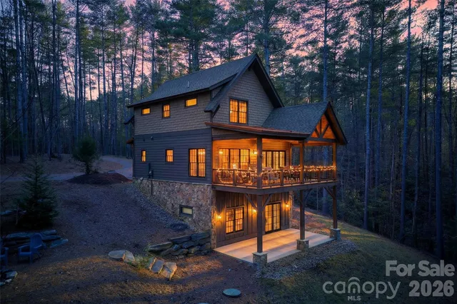 a view of a house with yard and sitting area