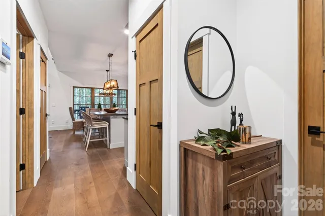 a very nice looking room with a dining table chairs and entryway