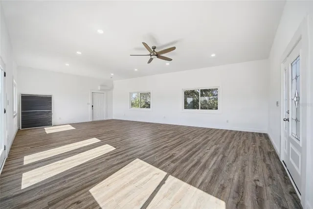 a view of balcony with wooden floor and fence