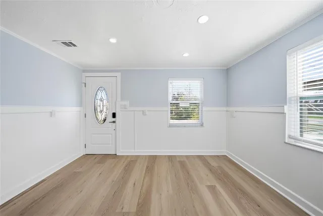 a view of a refrigerator in kitchen and wooden floor