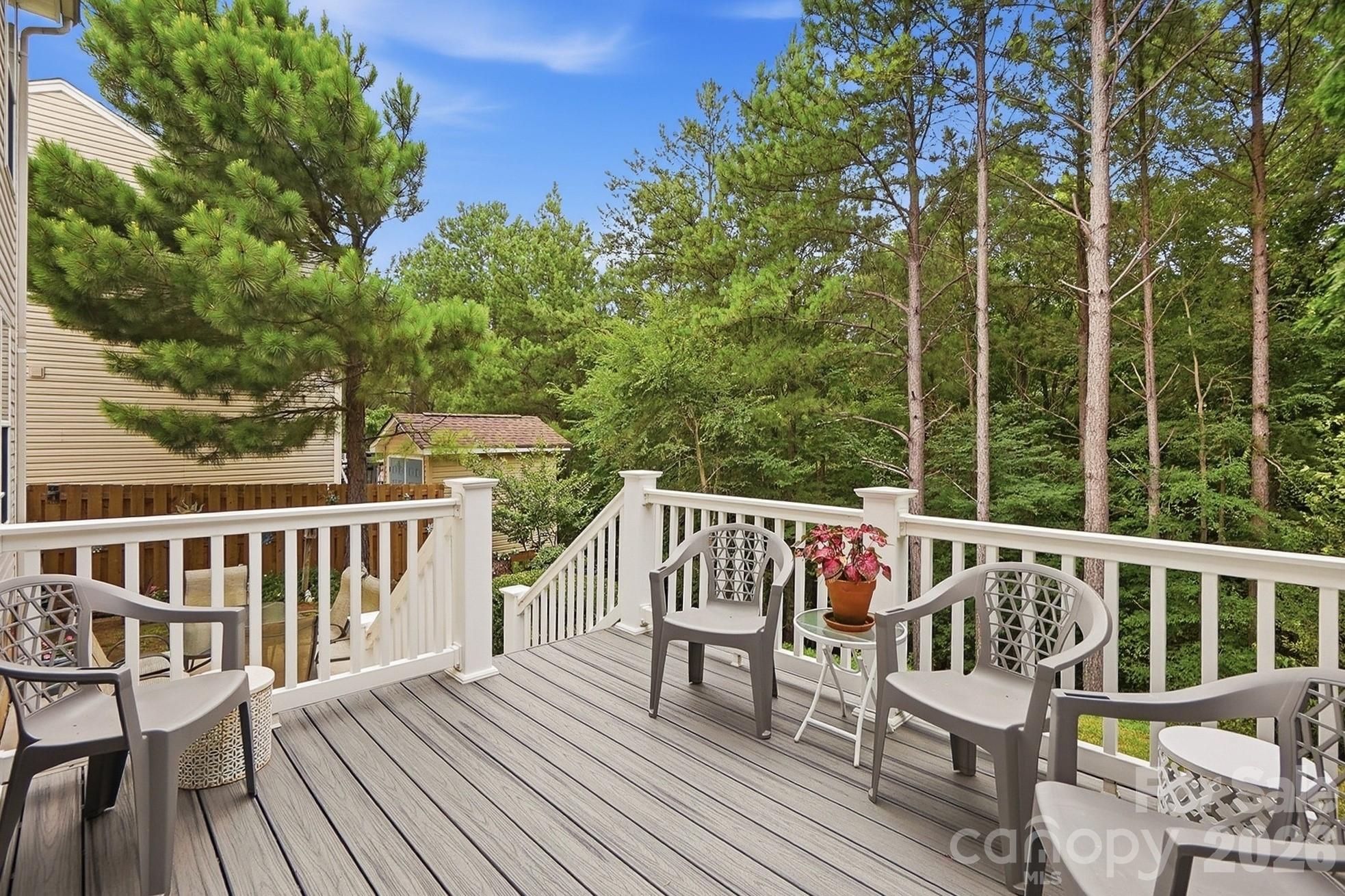 442 Sugar Maple Drive Tega Cay, SC 29708 - Photo 32 of 48 a view of a wooden deck with furniture