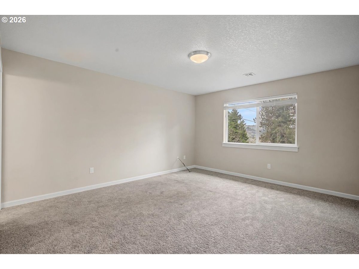 9 North Moolack Way Otis, OR 97368 - Photo 15 of 38 an empty room with windows