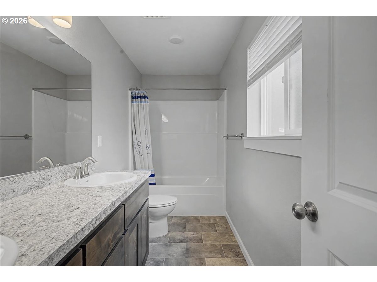 9 North Moolack Way Otis, OR 97368 - Photo 19 of 38 a bathroom with a granite countertop sink toilet and shower