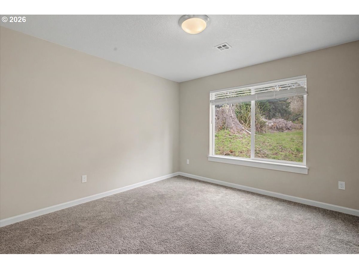 9 North Moolack Way Otis, OR 97368 - Photo 21 of 38 an empty room with windows